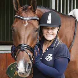 A woman and her horse. She is wearing navy blue IceRays Sun Sleeves for Maximum sun protection while horseback riding. Horse-Riding 